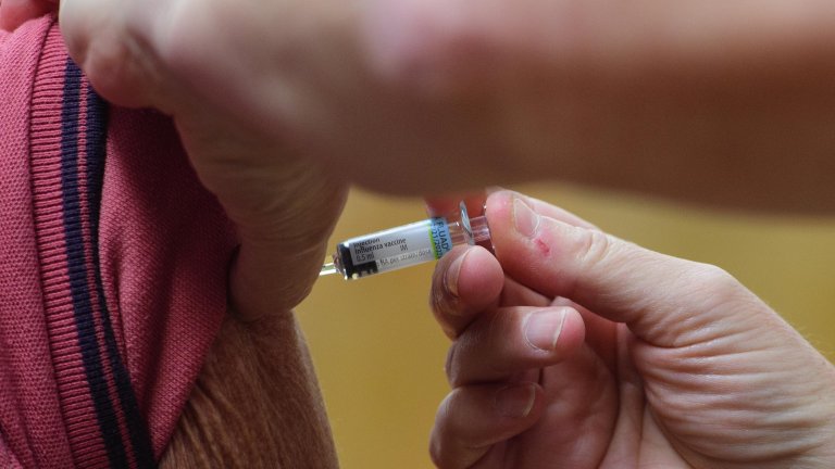Chris Vaughan Photography - commercial photography | A close up of a Covid-19 vaccination being injected into the arm of a patient.