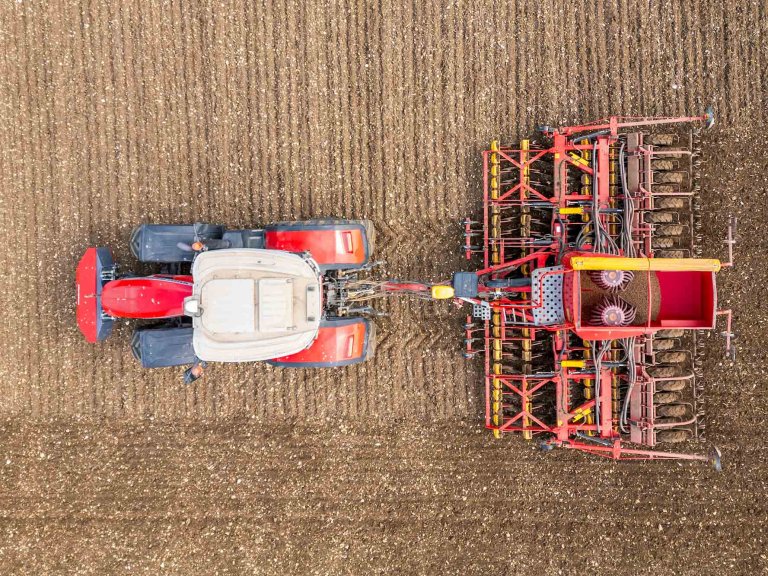 A drone image of a tractor working in a field.
