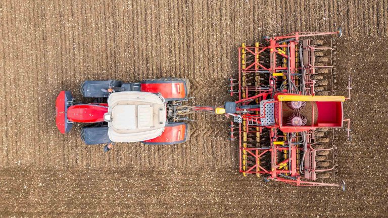 A drone image of a tractor working in a field.