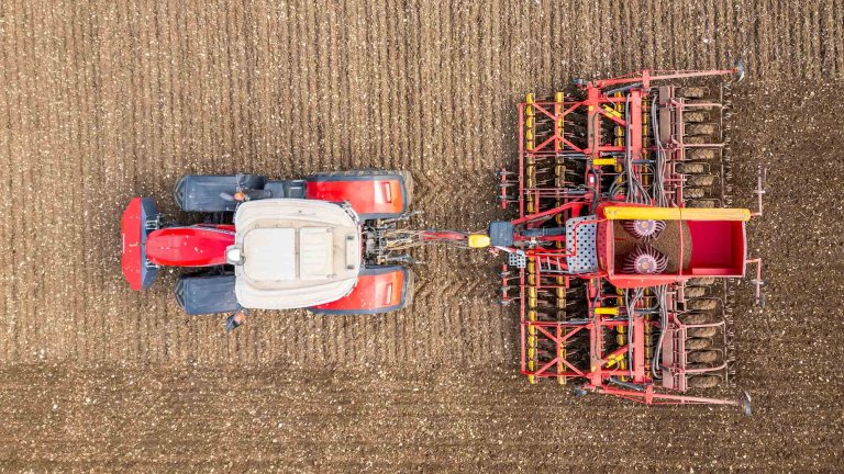 A drone image of a tractor working in a field.