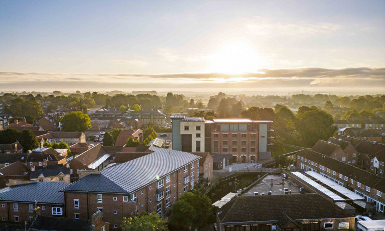 An images, taken from a drone, of the Hub in Sleaford, Lincolnshire. The picture was taken as the sun was rising on a summer day giving the image a picturesque feel.