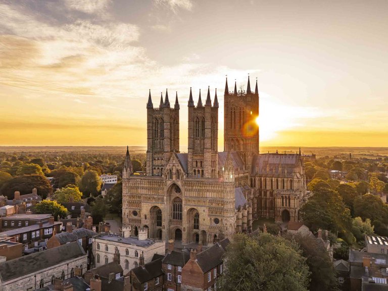 An aerial image of Lincoln Cathedral at sunrise.