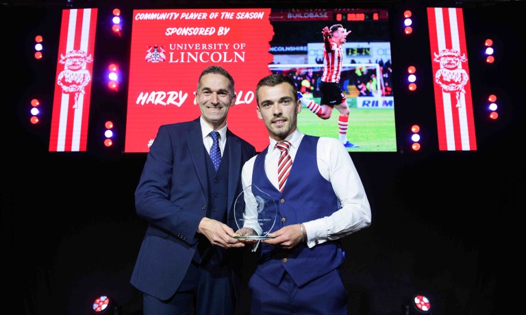 Chris Vaughan Photography - corporate event images | An on-stage trophy presentation for Lincoln City's end of season awards.