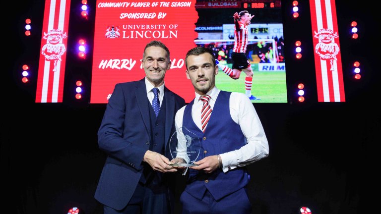 Chris Vaughan Photography - corporate event images | An on-stage trophy presentation for Lincoln City's end of season awards.