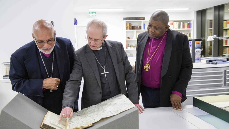 Chris Vaughan Photography - PR and communications images | Three Archbishops inspect old documents that are being restored.