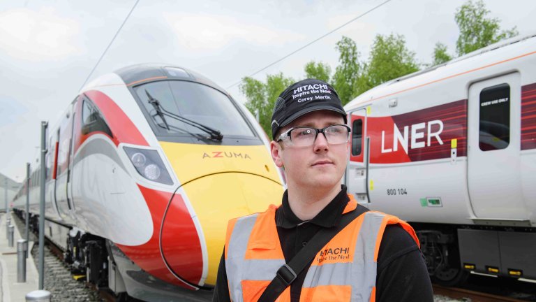 Chris Vaughan Photography - PR and communications images | A train engineer stands in front of an LNER Azuma train.