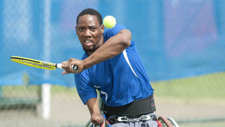 Chris Vaughan Photography - Sports images | Triple amputee Lucas Sithole during a tennis match.