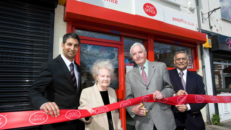 Chris Vaughan Photography - PR and communications images | Labour MP Dennis Skinner cuts a ribbon to official open a refurbished Post Office.