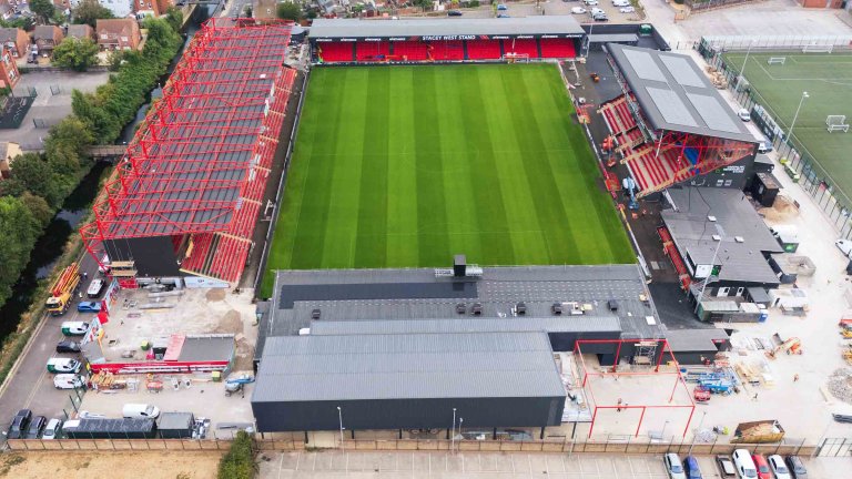 An aerial/drone photograph showing construction progress at the Imps Territory redevelopment.