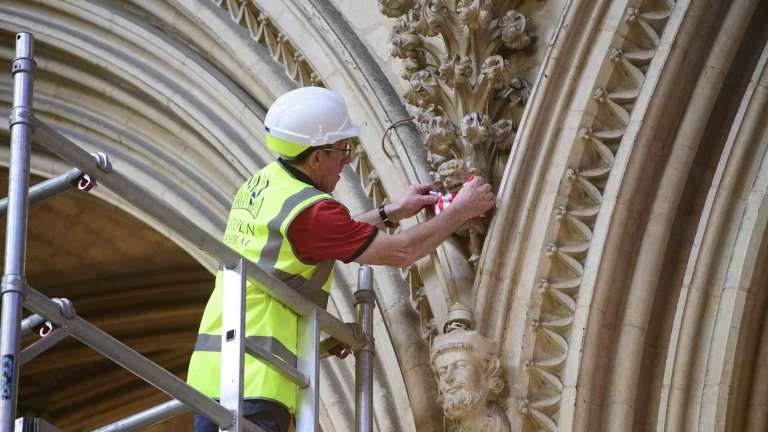 To mark Lincoln City winning the Sky Bet League One title, Lincoln Cathedral had placed a mini replica shirt on the Lincoln Imp inside the Cathedral.