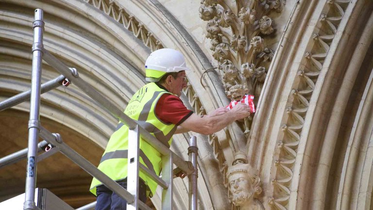 To mark Lincoln City winning the Sky Bet League One title, Lincoln Cathedral had placed a mini replica shirt on the Lincoln Imp inside the Cathedral.