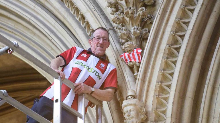 To mark Lincoln City winning the Sky Bet League One title, Lincoln Cathedral had placed a mini replica shirt on the Lincoln Imp inside the Cathedral.