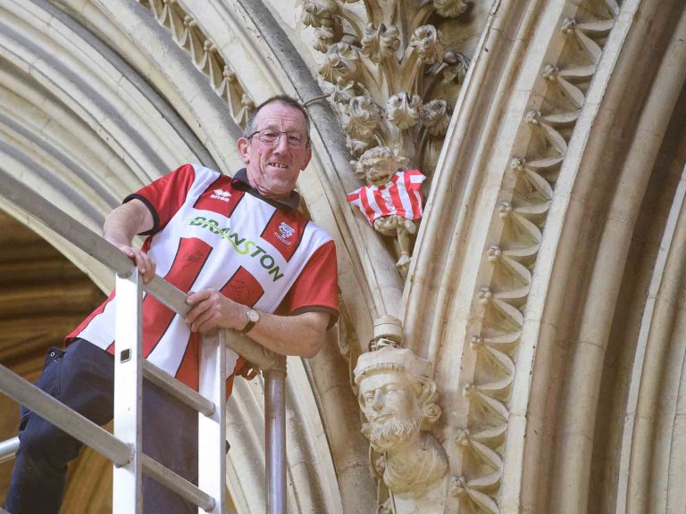 To mark Lincoln City winning the Sky Bet League One title, Lincoln Cathedral had placed a mini replica shirt on the Lincoln Imp inside the Cathedral.