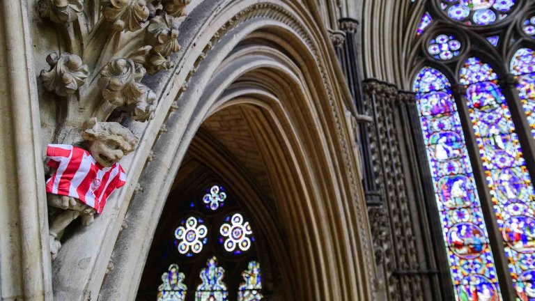 To mark Lincoln City winning the Sky Bet League One title, Lincoln Cathedral had placed a mini replica shirt on the Lincoln Imp inside the Cathedral.