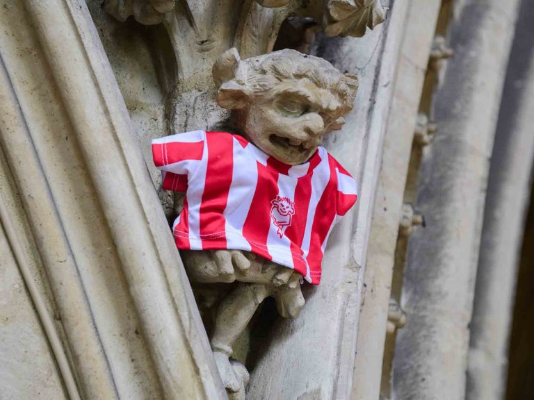 To mark Lincoln City winning the Sky Bet League One title, Lincoln Cathedral had placed a mini replica shirt on the Lincoln Imp inside the Cathedral.