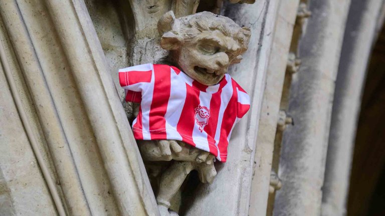 To mark Lincoln City winning the Sky Bet League One title, Lincoln Cathedral had placed a mini replica shirt on the Lincoln Imp inside the Cathedral.