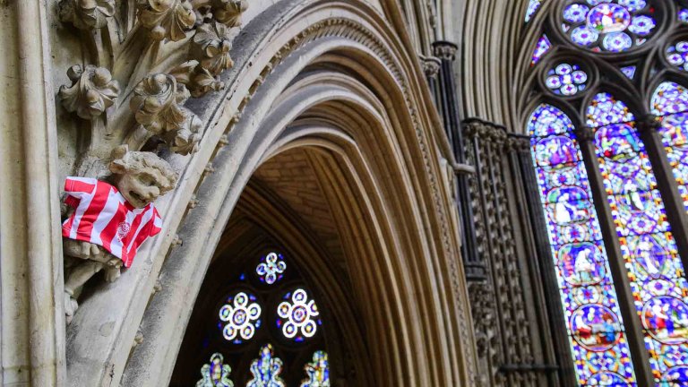 To mark Lincoln City winning the Sky Bet League One title, Lincoln Cathedral had placed a mini replica shirt on the Lincoln Imp inside the Cathedral.