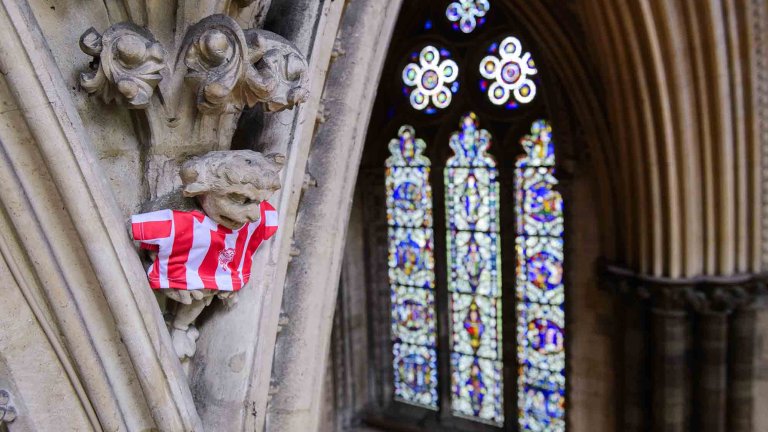 To mark Lincoln City winning the Sky Bet League One title, Lincoln Cathedral had placed a mini replica shirt on the Lincoln Imp inside the Cathedral.