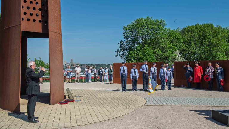 A bugler plays the Last Post during a service of thanksgiving at International Bomber Command Centre.