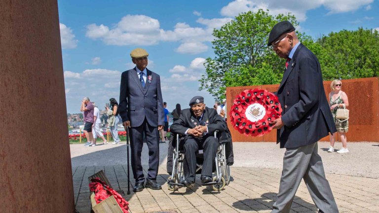 Sidney McFarlane MBE lays a wreath at International Bomber Command Centre on behalf of British West India Regiments.