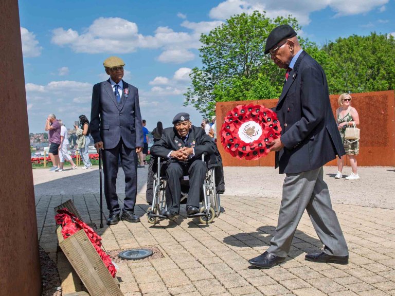 Sidney McFarlane MBE lays a wreath at International Bomber Command Centre on behalf of British West India Regiments.