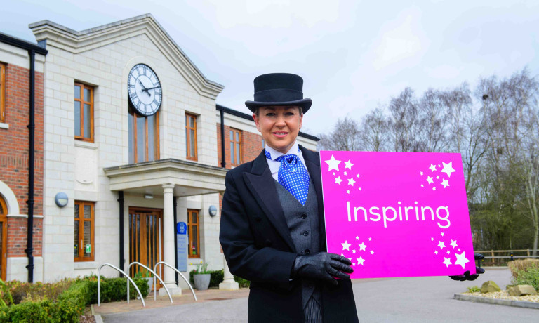 Chris Vaughan Photography - commercial images | A Lincolnshire Co-op funeral director holds a board reading Inspiring.