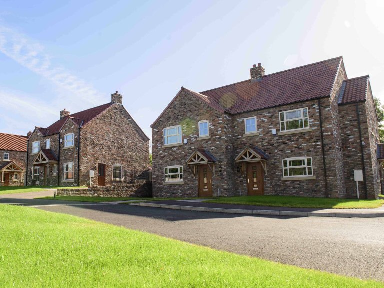 Chris Vaughan Photography - commercial images | A line of new-build houses.