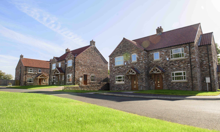 Chris Vaughan Photography - commercial images | A line of new-build houses.