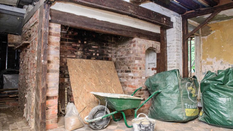 An image of the fireplace inside the Old Kings Head during renovation work.
