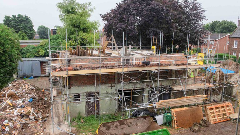 A picture of the old out buildings at the Old Kings Head at the start of renovation.