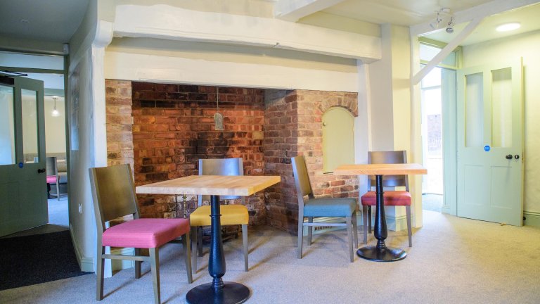 An internal image of the Old Kings Head showing the refurbished fireplace.