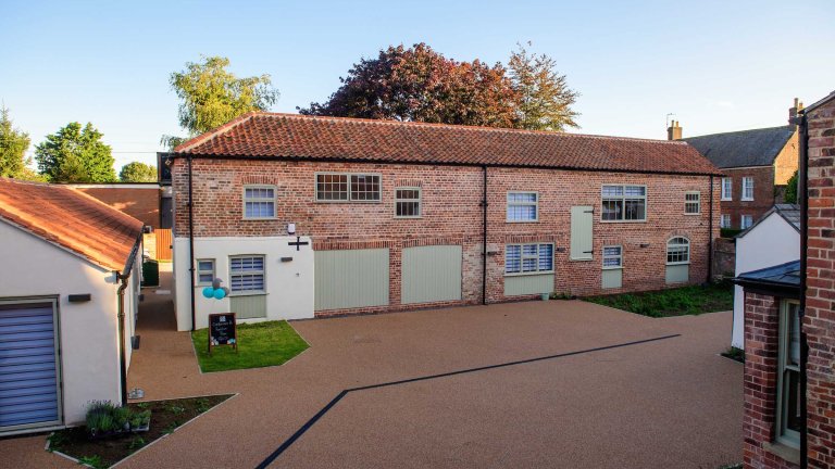 An exterior image of the refurbished out buildings at the Old Kings Head.