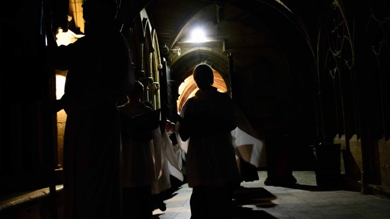 Chris Vaughan - case study images: Lincoln Cathedral | Choir members are silhouetted as they walk through the Cathedral.