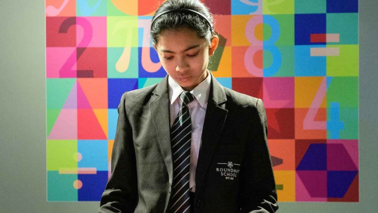 Chris Vaughan - case study images: MathsCity | A youngster undertakes a task.