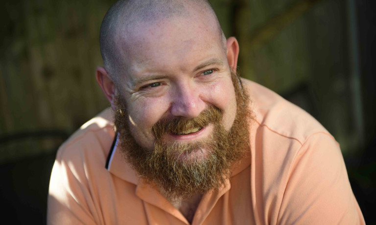 A profile picture of Chris Vaughan, owner of Chris Vaughan Photography, looking off camera.