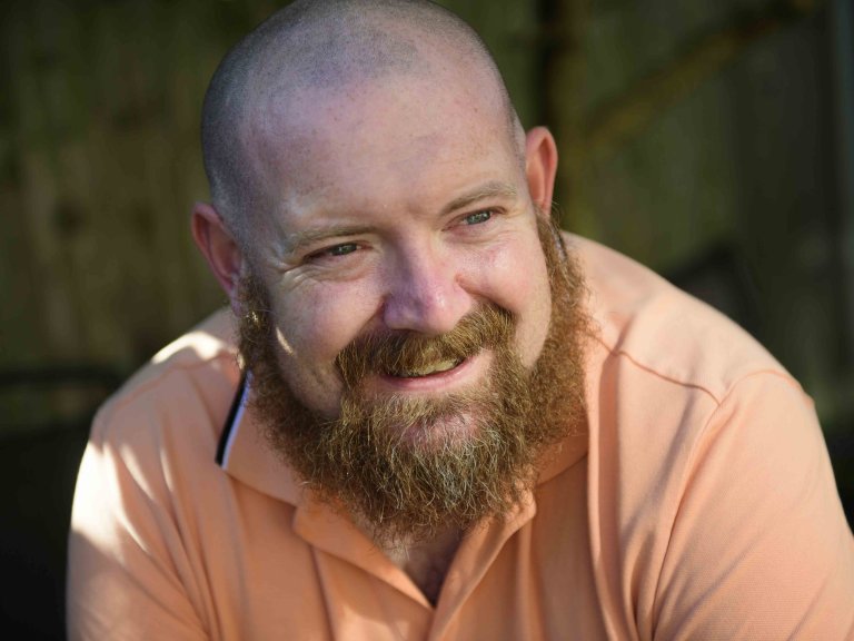 A profile picture of Chris Vaughan, owner of Chris Vaughan Photography, looking off camera.