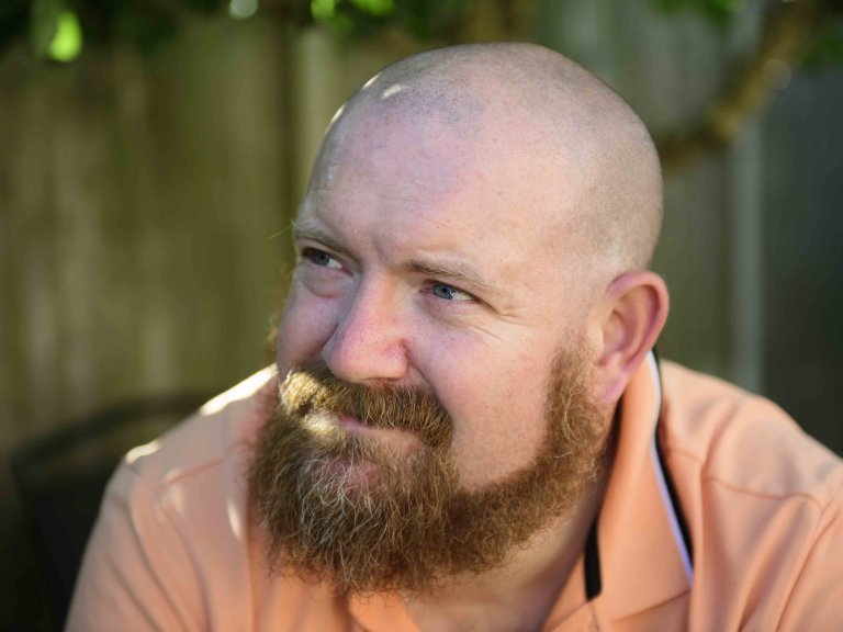 A profile picture of Chris Vaughan, owner of Chris Vaughan Photography, looking off camera.
