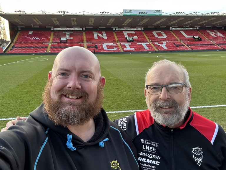 A selfie of Chris with his Dad, Andrew, at Lincoln City's LNER Stadium.